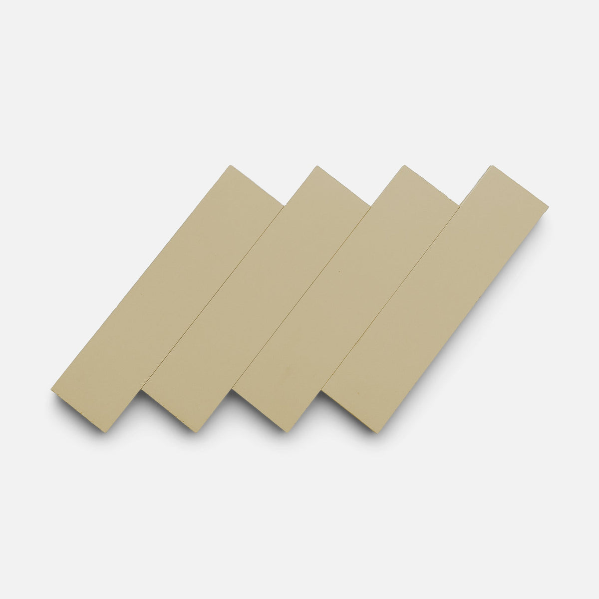 Four Truffle 2x8 tiles by Zia Tile are arranged diagonally in a staggered, overlapping pattern on a plain white background.