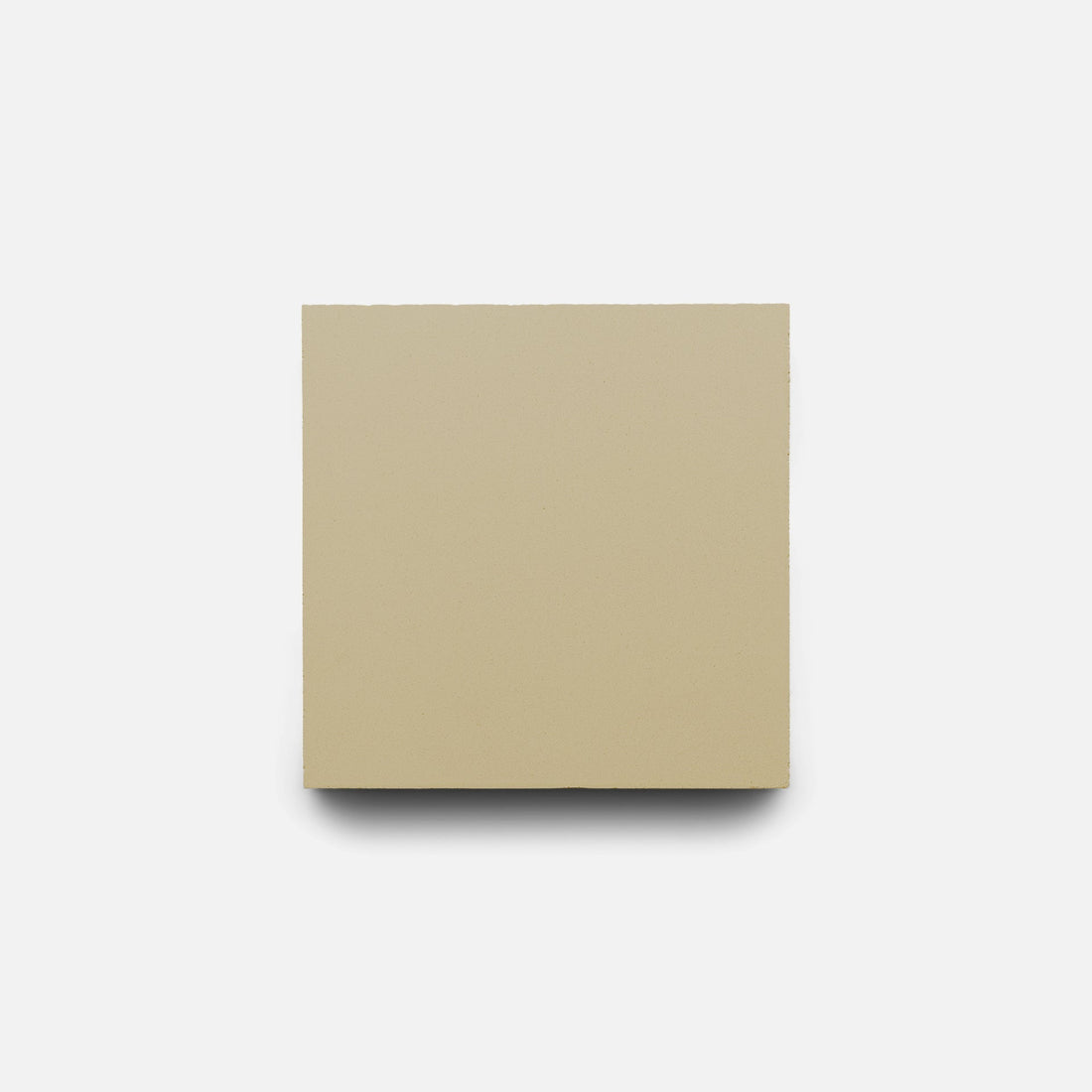 The Truffle 4x4 tile by Zia Tile, a handmade, square beige tile, is centered on a white background with a subtle shadow beneath.