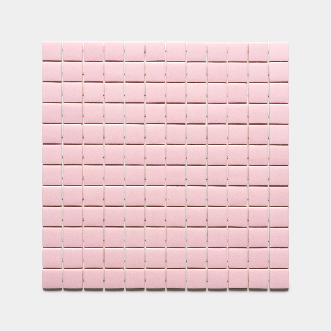 A square grid of Tulip 1x1 light pink tiles by Zia Tile is arranged evenly on a flat white background.