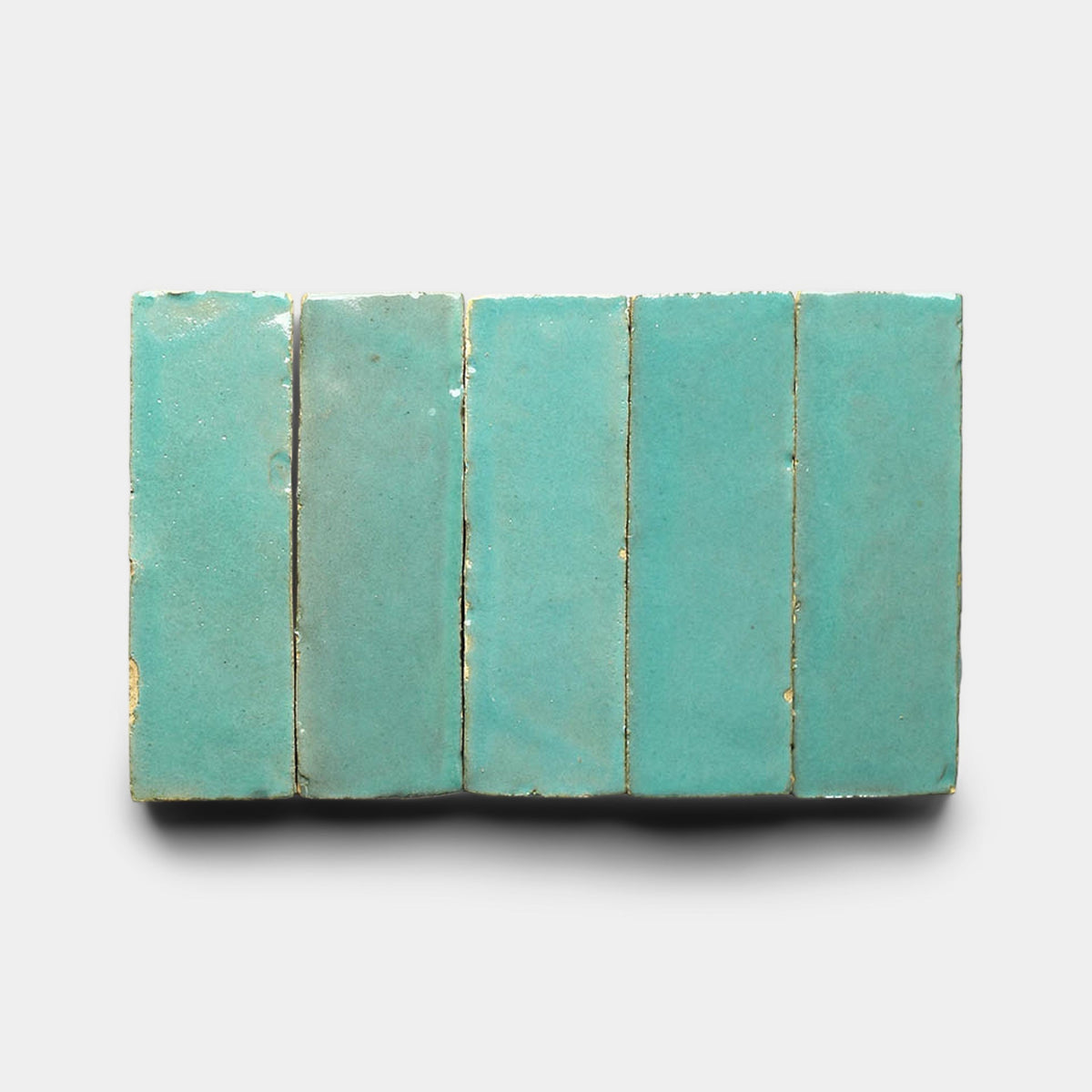 Five Tulum 2x2 sample tiles by Zia Tile are arranged vertically side by side on a white background, showcasing their rectangular turquoise design with clean, visible grout lines between each tile.