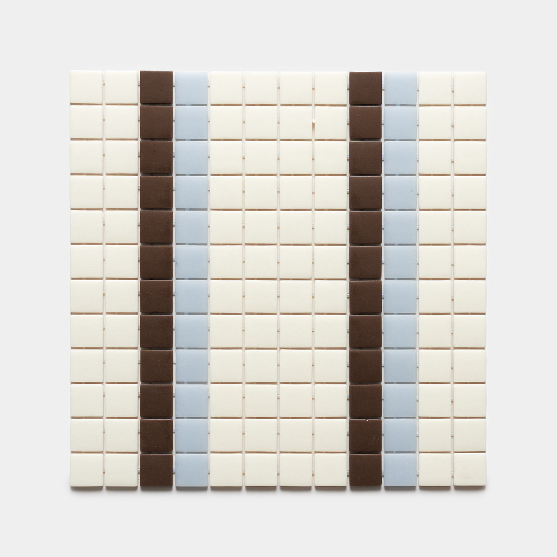 A grid of small square Union Milk + Marmot + Tranquil Blue tiles by Zia Tile features vertical stripes of brown and light blue set against an off-white background.