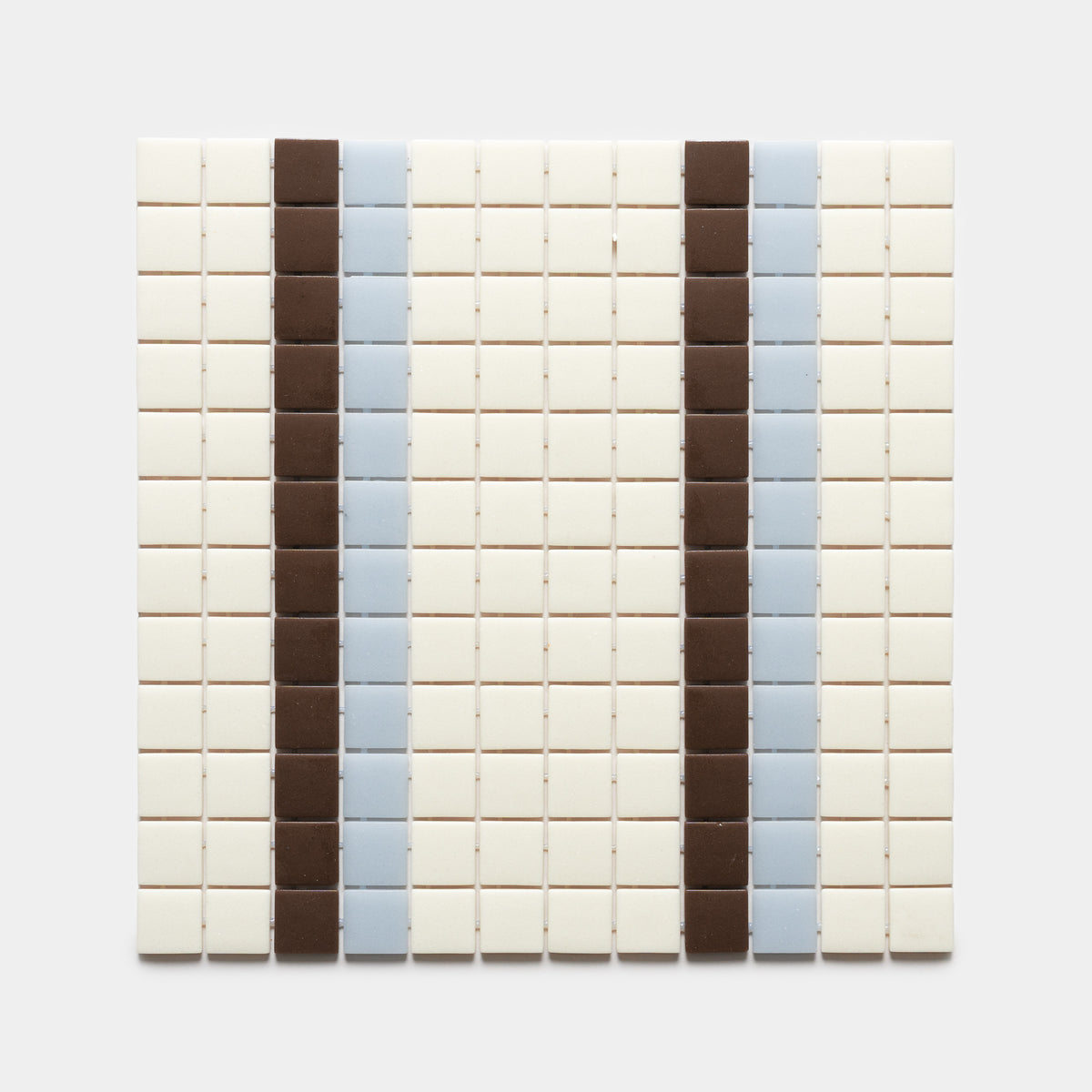 A grid of small square Union Milk + Marmot + Tranquil Blue tiles by Zia Tile features vertical stripes of brown and light blue set against an off-white background.