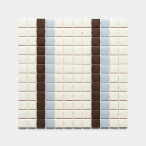 A grid of small square Union Milk + Marmot + Tranquil Blue tiles by Zia Tile features vertical stripes of brown and light blue set against an off-white background.