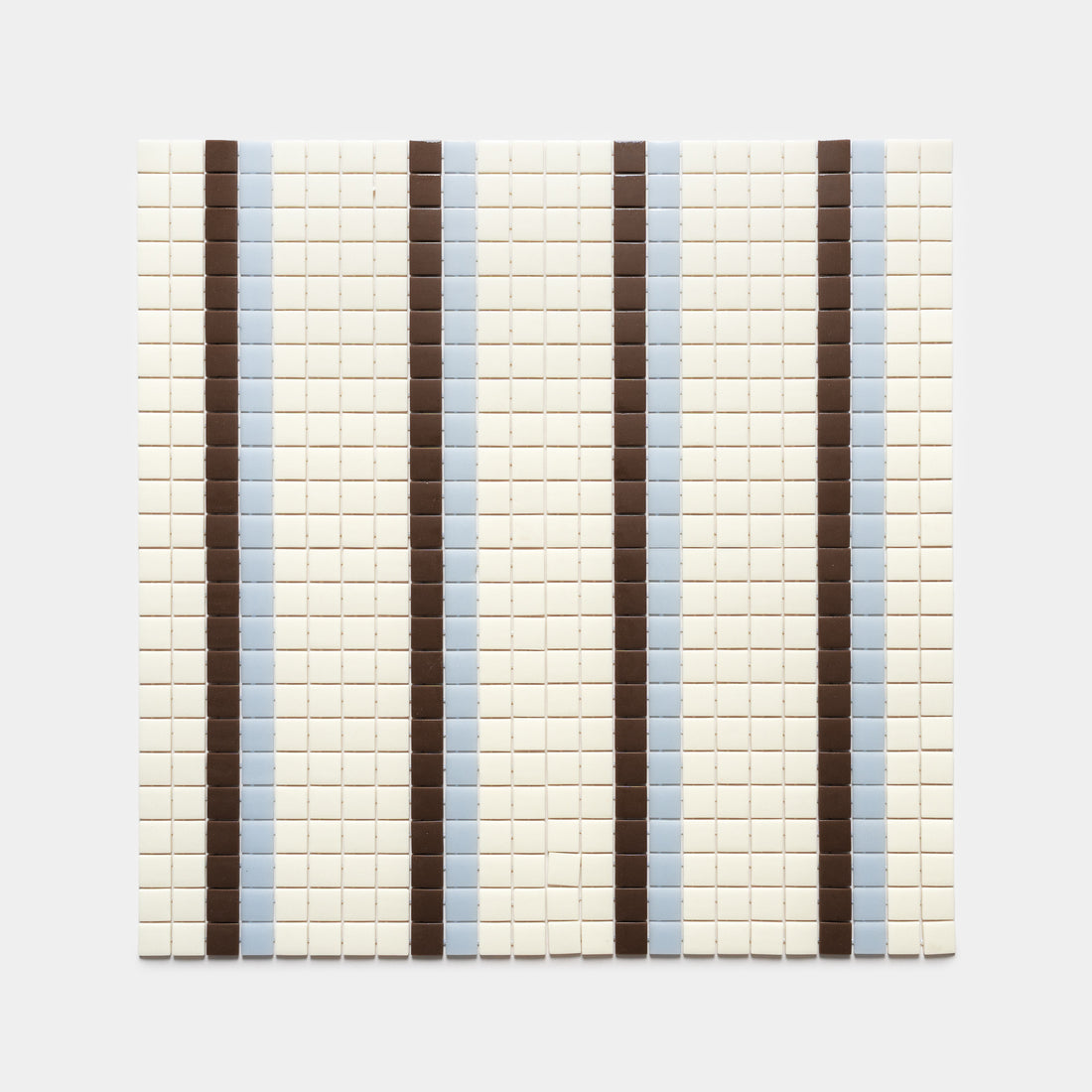 Union Milk + Marmot + Tranquil Blue by Zia Tile features a grid of small square tiles with alternating light brown and blue stripes on an off-white background, creating an evenly repeating vertical pattern.