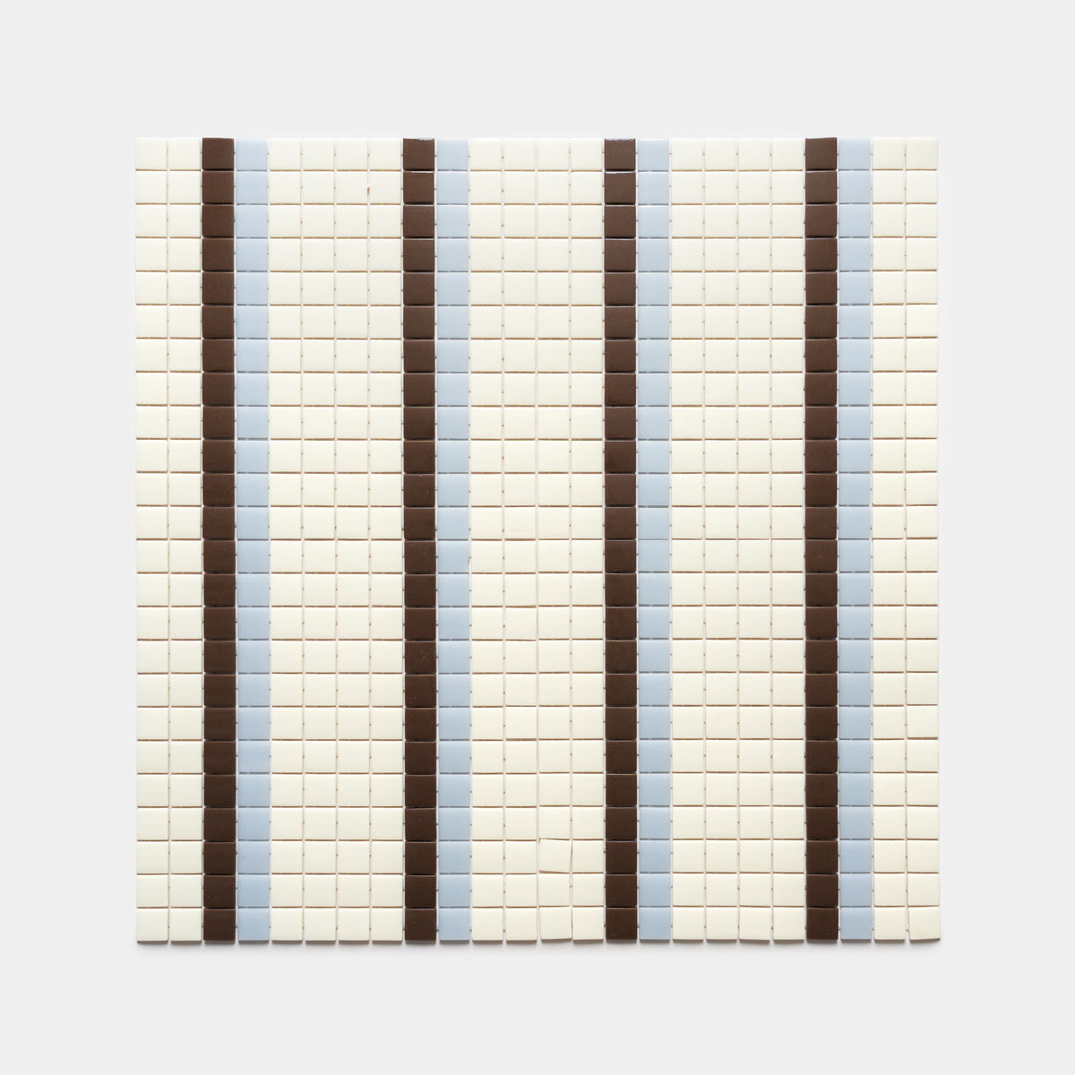Union Milk + Marmot + Tranquil Blue by Zia Tile features a grid of small square tiles with alternating light brown and blue stripes on an off-white background, creating an evenly repeating vertical pattern.