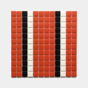 A rectangular grid of mostly red tiles with two vertical black stripes and two vertical white stripes on light gray, featuring Union Roma + Jet Black + Milk, Sample by Zia Tile.