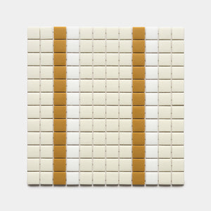 A grid of small, square Union Milk + Rye + Paperwhite tiles by Zia Tile features two vertical columns of mustard-yellow tiles on an off-white background.