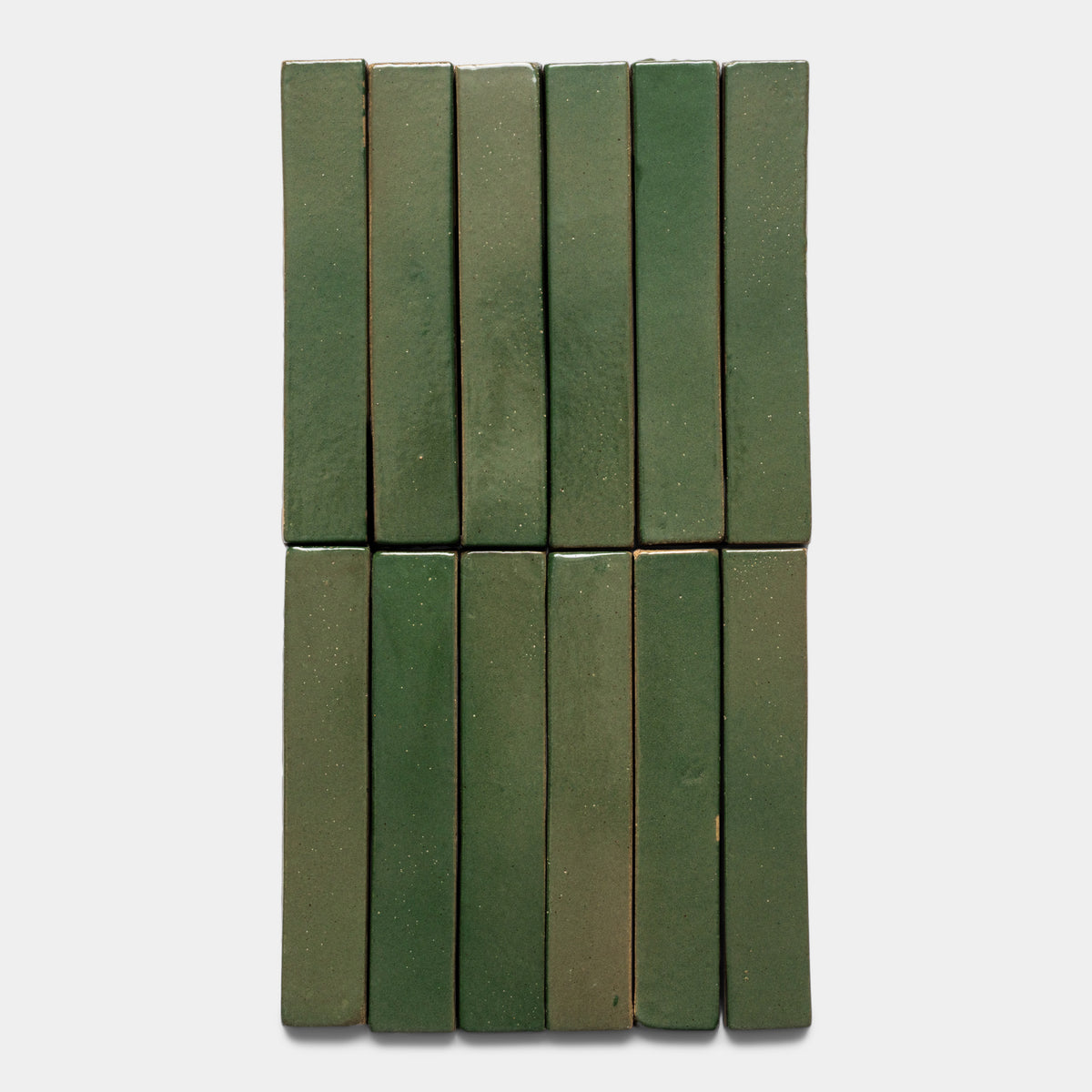 Twelve glossy green Valverde Mini Bar tiles by Zia Tile are arranged in two rows of six, set against a plain white background.