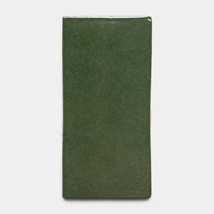 The Valverde 4x8 Rectangle by Zia Tile is a glossy green ceramic tile with a rectangular shape, shown against a plain white background.