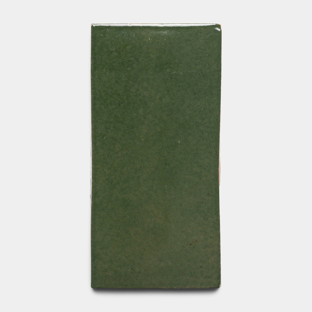 The Valverde 4x8 Rectangle by Zia Tile is a glossy green ceramic tile with a rectangular shape, shown against a plain white background.