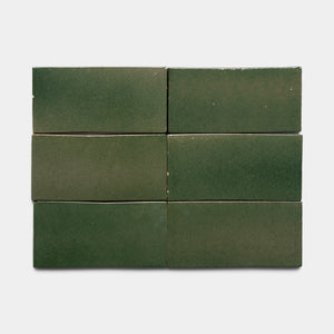Six Valverde 4x8 Rectangle tiles by Zia Tile, featuring a glossy green finish with subtle color variations and slightly uneven surfaces, are arranged in two rows of three on a light gray background.