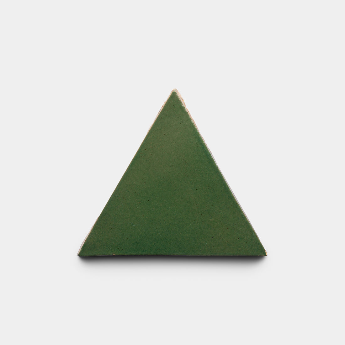 The Zia Tile Valverde Triangle, a green equilateral tile with gently beveled edges, is centered against a plain white background.