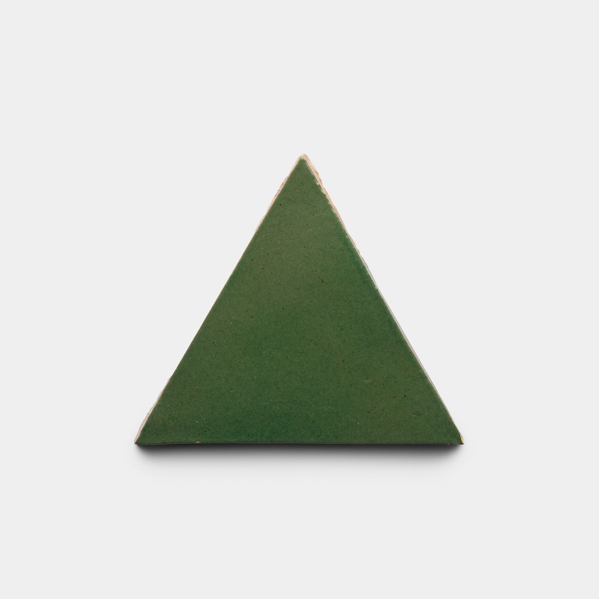 The Zia Tile Valverde Triangle, a green equilateral tile with gently beveled edges, is centered against a plain white background.