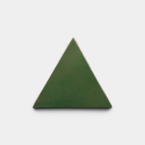 The Zia Tile Valverde Triangle, a green equilateral tile with gently beveled edges, is centered against a plain white background.