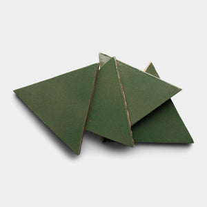 Five Valverde Triangle tiles by Zia Tile, in green ceramic, are arranged overlapping on a plain white background.