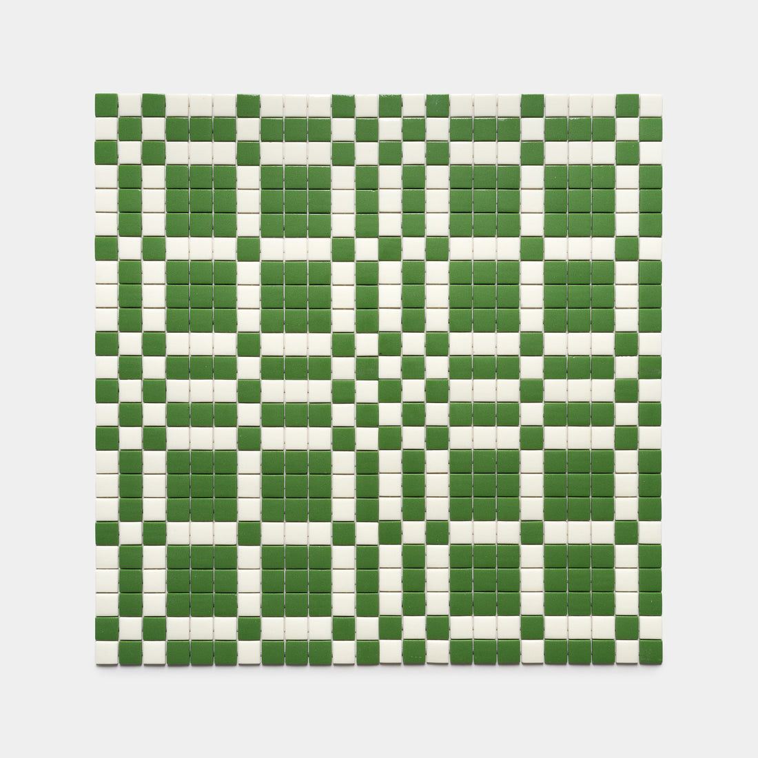 The Vaso Clover + Milk by Zia Tile features a grid of small square tiles in alternating green and white, creating a striking checkered geometric pattern against a white background.