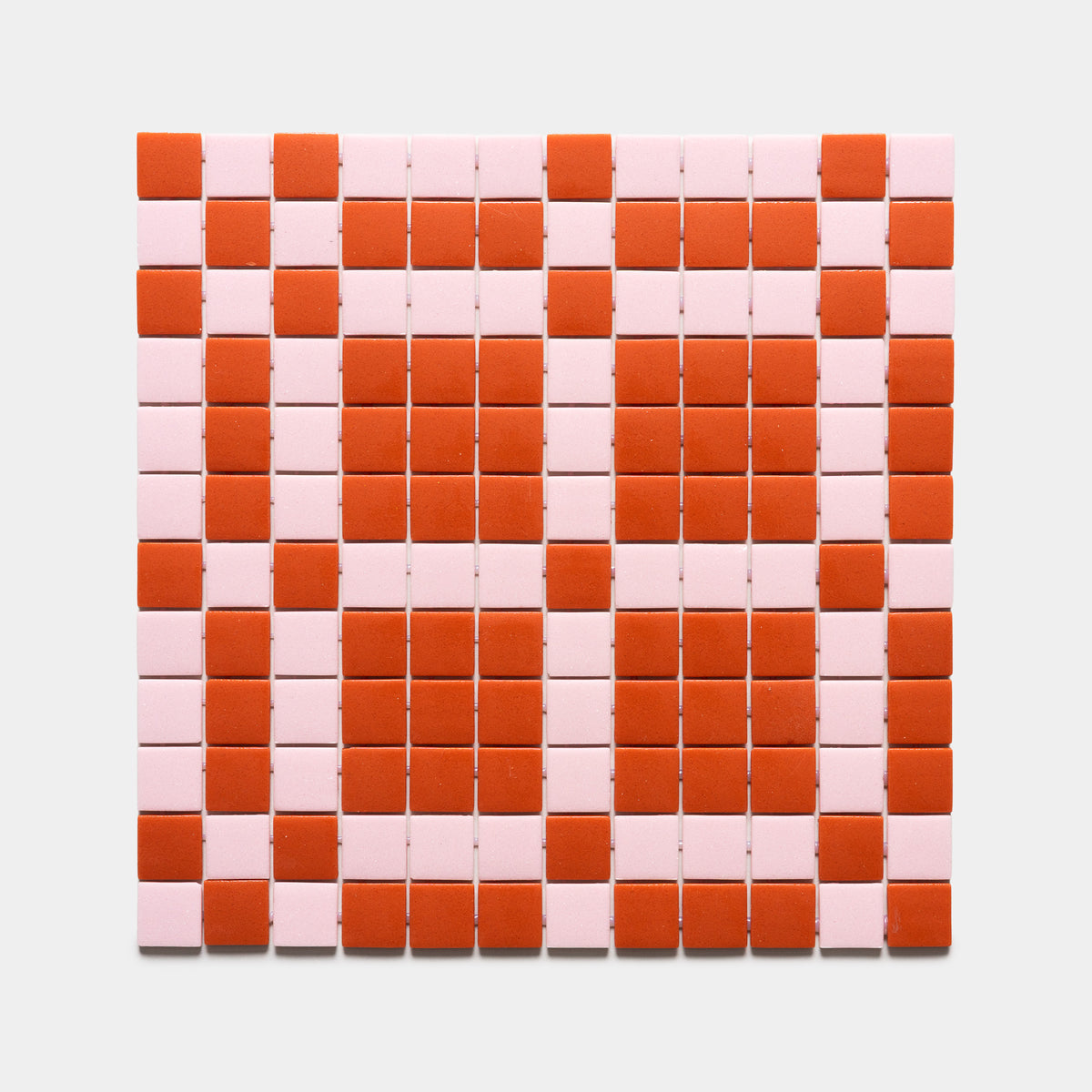 The Vaso Roma + Tulip, Sample by Zia Tile features a geometric checkerboard pattern with small square tiles in alternating rows of red and light pink on a white background.