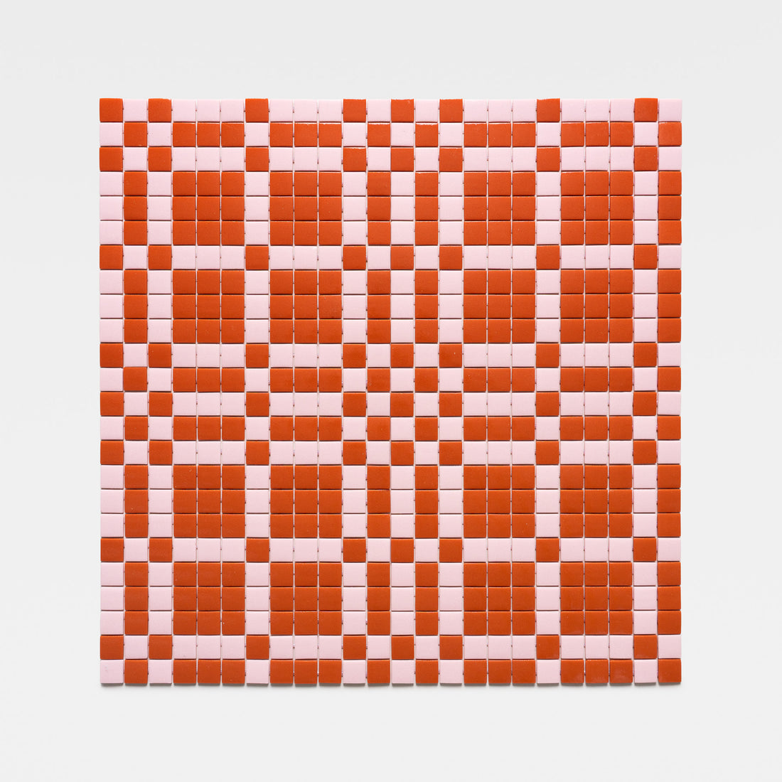 The Vaso Roma + Tulip tile by Zia Tile features a geometric checkerboard pattern of red and pink squares and rectangles on a crisp white background.