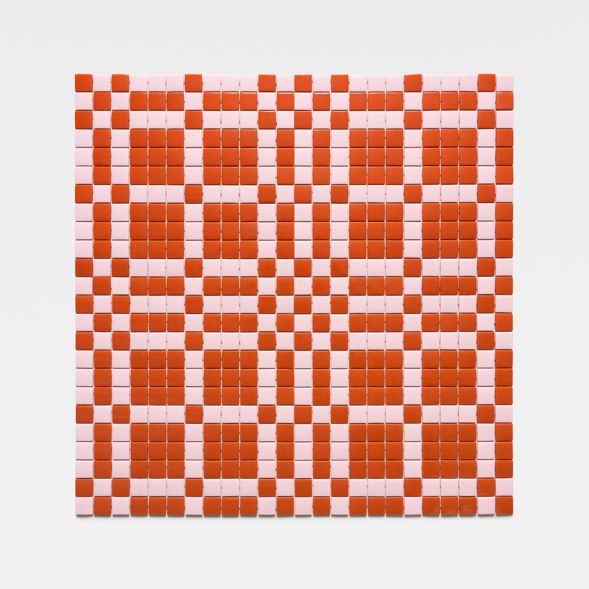 The Vaso Roma + Tulip tile by Zia Tile features a geometric checkerboard pattern of red and pink squares and rectangles on a crisp white background.