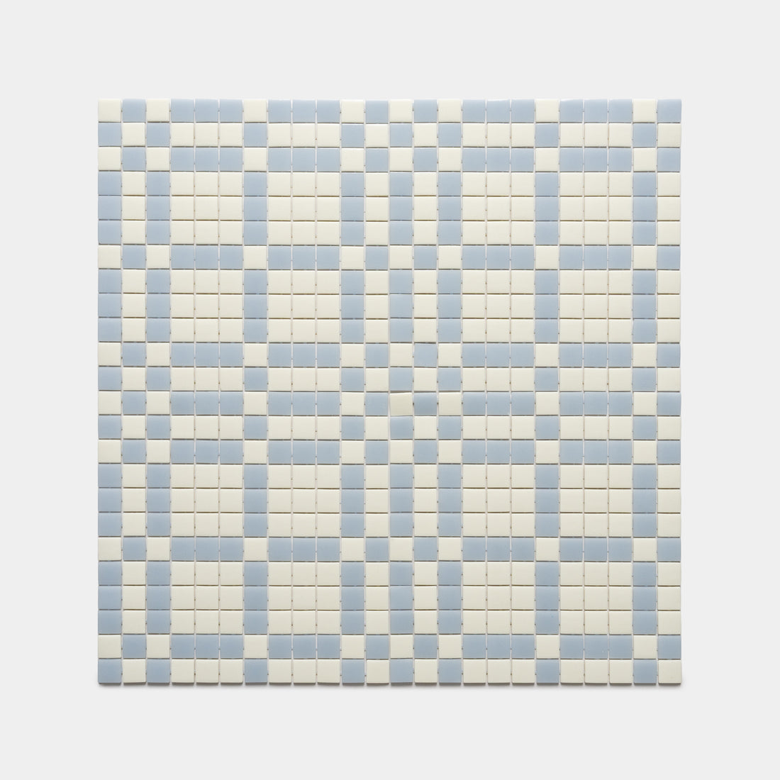 Vaso Milk + Tranquil Blue by Zia Tile features a square grid of small, light blue and off-white tiles in a repeating geometric checkered pattern.