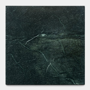 The Verde Alpi 24x24 slab from Zia Tile features a dark green surface with subtle white and light green veins, capturing the natural elegance and handmade aesthetic of the brand’s signature collections.