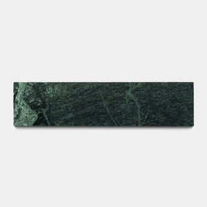 The Verde Alpi 3x12 by Zia Tile is a rectangular dark green marble tile with lighter green veins, displayed on a plain white background.