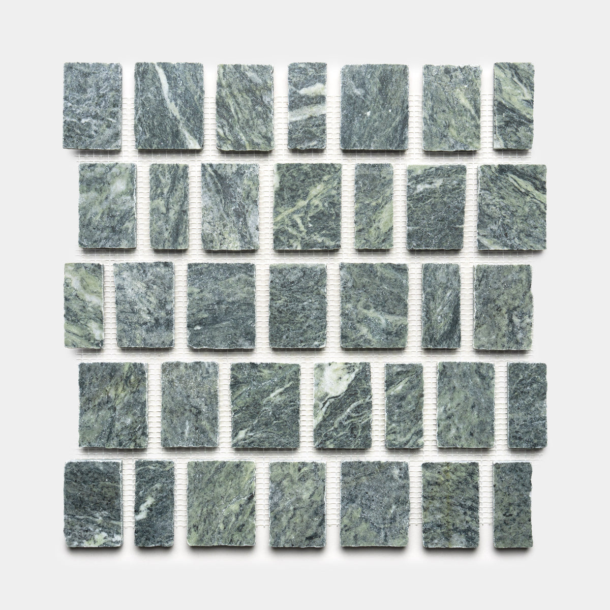 Scarpa in Verde Alpi by Zia Tile showcases square, gray-green stone tiles with white veining and a rough, natural texture. Set against a white background, each tile is separated by small, even gaps for a refined look.