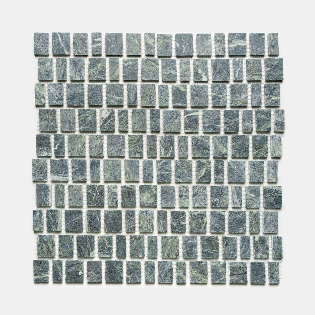 Scarpa in Verde Alpi by Zia Tile features small, greenish-gray stone tiles in a square mosaic grid pattern set against a white background.