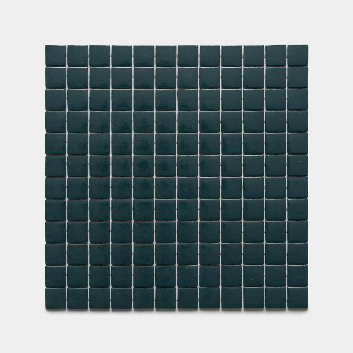 A grid of Vespertine 1x1 dark green square tiles by Zia Tile, arranged evenly on a white background.