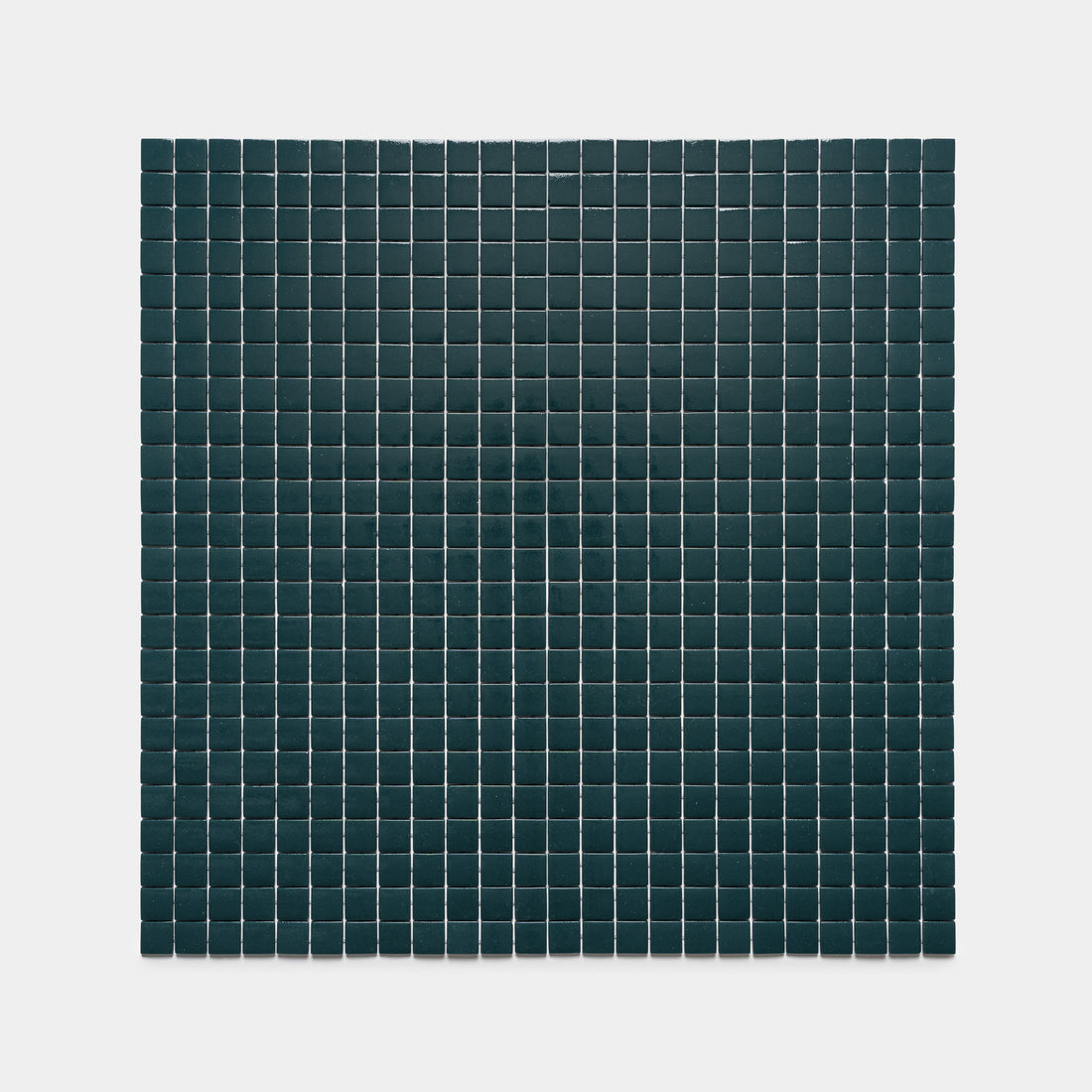 The Vespertine 1x1 by Zia Tile features a grid of small, dark square tiles set evenly in rows and columns on a light gray background, creating a minimalist geometric pattern.