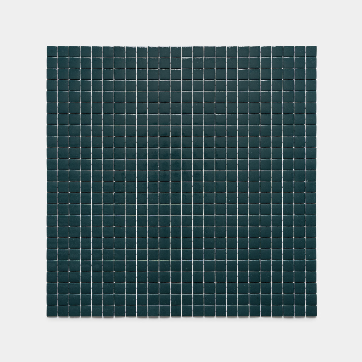 The Vespertine 1x1 by Zia Tile features a grid of small, dark square tiles set evenly in rows and columns on a light gray background, creating a minimalist geometric pattern.