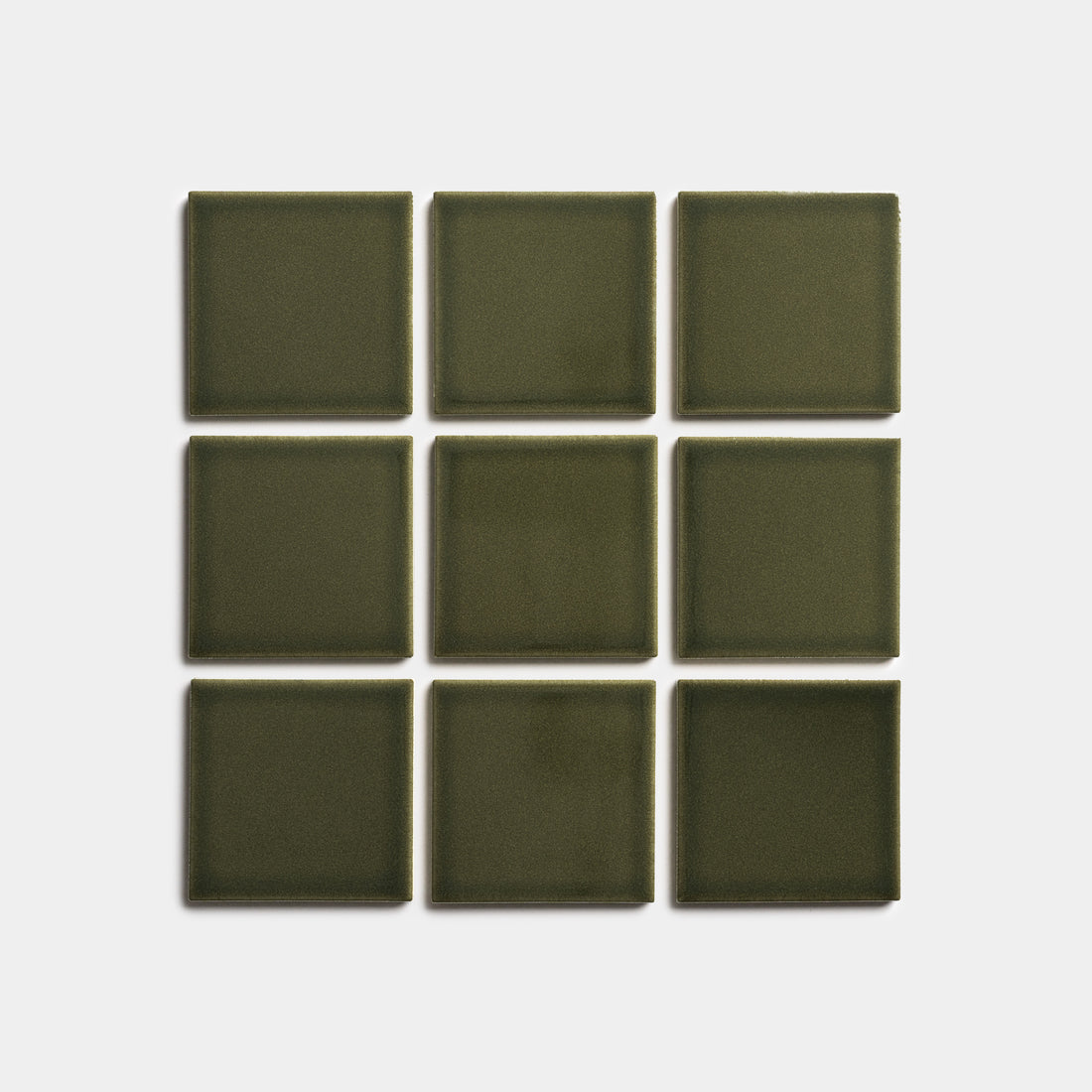 Nine Vetiver 4x4 olive green tiles by Zia Tile, arranged in a 3x3 grid on a plain white background.