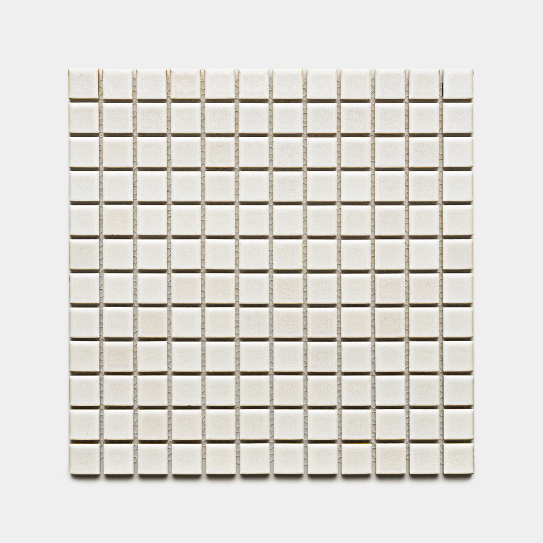A grid of Wool 1x1 small, square, off-white ceramic tiles by Zia Tile arranged symmetrically on a plain white background.