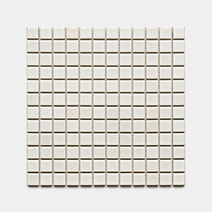 A grid of Wool 1x1 small, square, off-white ceramic tiles by Zia Tile arranged symmetrically on a plain white background.