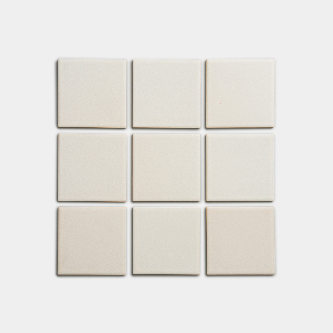 Nine cream-colored Wool 4x4 tiles by Zia Tile, arranged in a three-by-three grid on a white background.