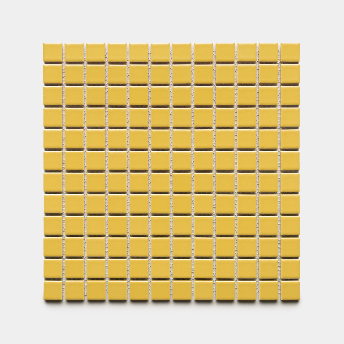 A square sheet of Zia Tile’s Yuzu 1x1 small yellow ceramic tiles is arranged in a grid against a white background.