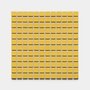 A square sheet of Zia Tile’s Yuzu 1x1 small yellow ceramic tiles is arranged in a grid against a white background.