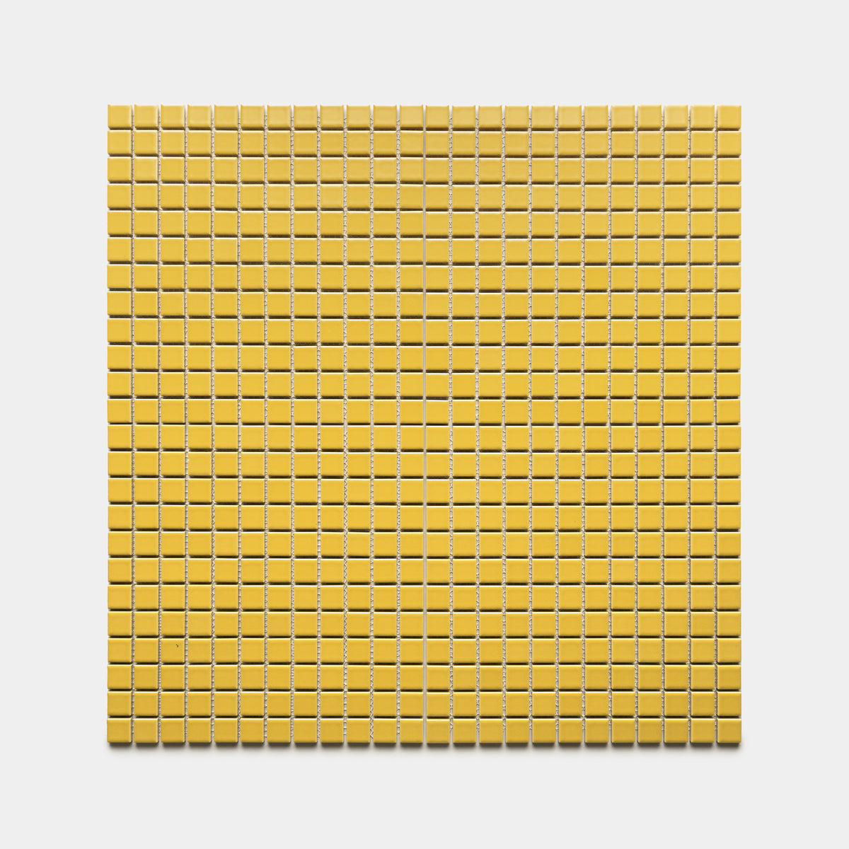 The Yuzu 1x1 tiles by Zia Tile feature a grid of small, evenly spaced yellow squares set against a white background, forming a uniform and orderly pattern.