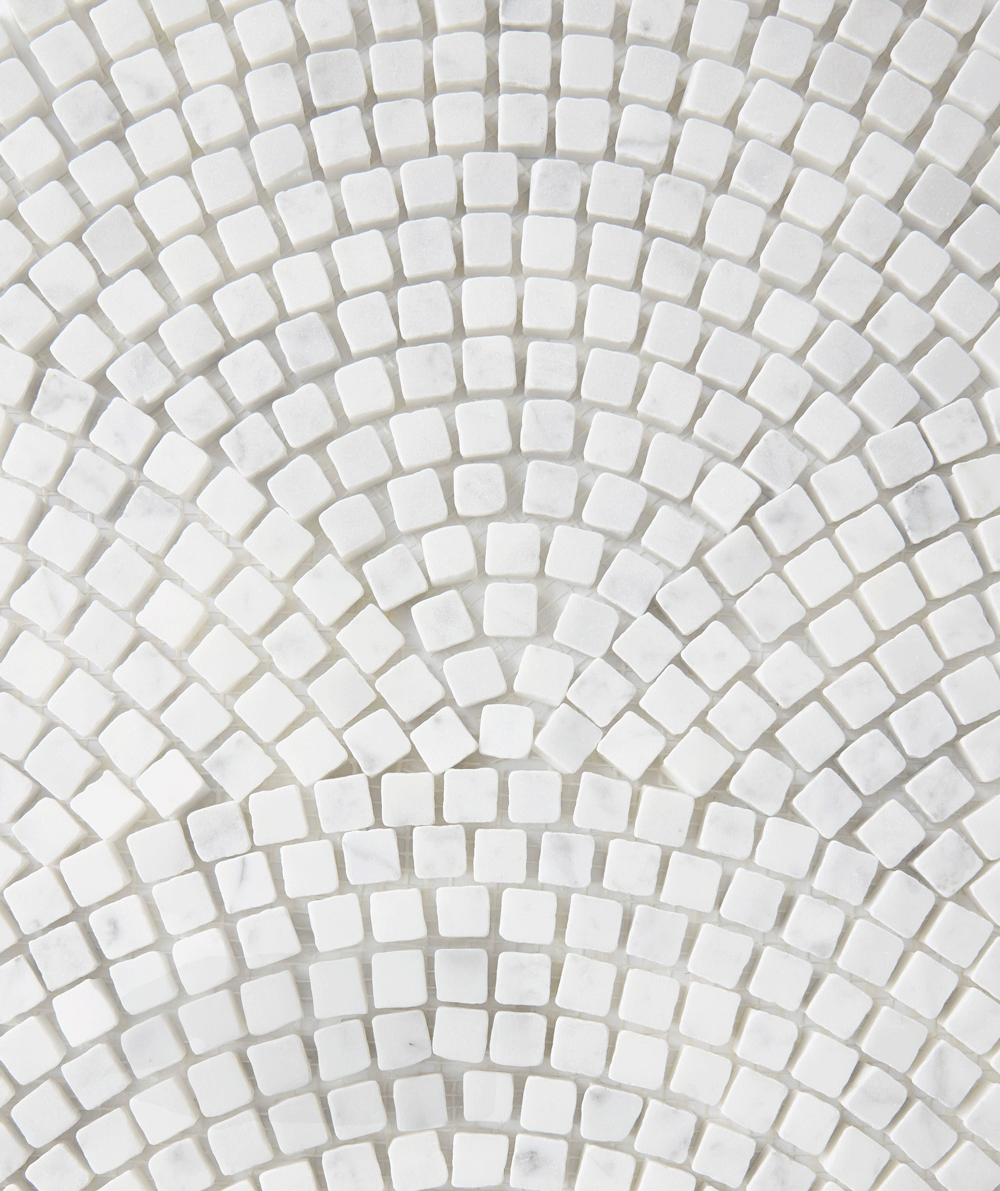 White square tiles arranged in a radial, fan-like pattern, creating a textured and geometric mosaic design. The arrangement forms concentric arcs, giving a sense of movement and depth to the image.