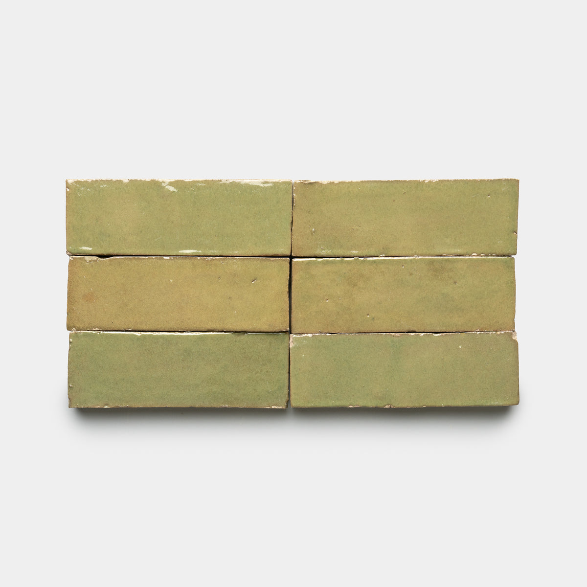Six Za'atar 2x6 olive-green bricks by Zia Tile are arranged in two rows of three each, set against a plain white background.
