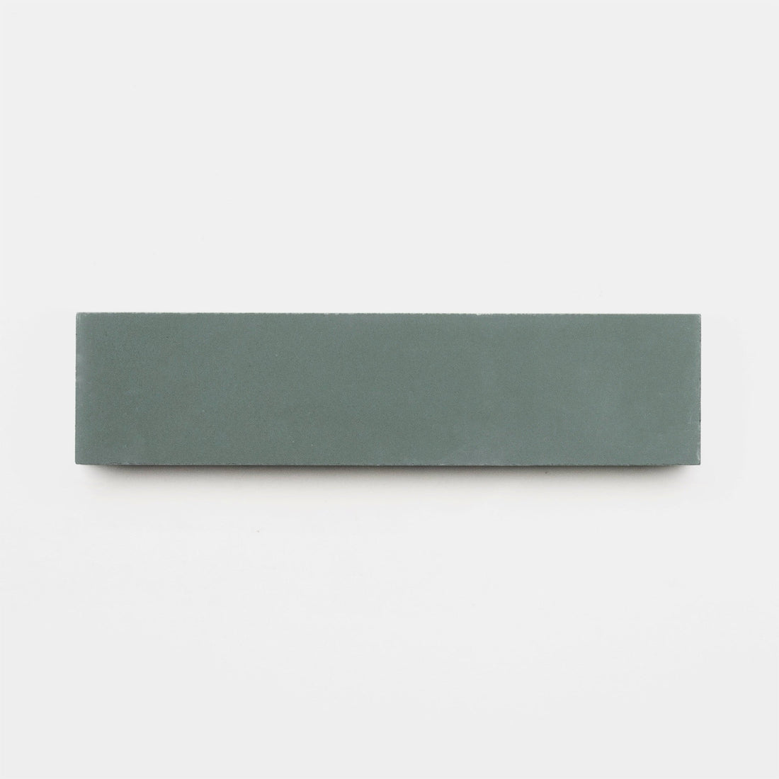 The Zeppelin 2x8 Sample by vendor-unknown is a rectangular, flat, green-grey sharpening stone displayed horizontally against a plain white background, similar in appearance to a smooth handmade tile.