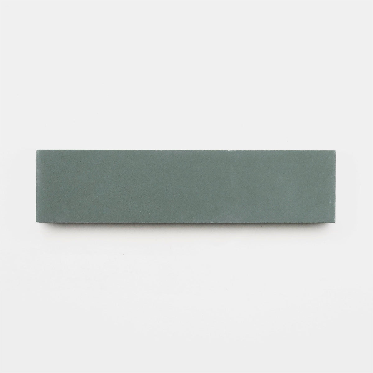 The Zeppelin 2x8 Sample by vendor-unknown is a rectangular, flat, green-grey sharpening stone displayed horizontally against a plain white background, similar in appearance to a smooth handmade tile.