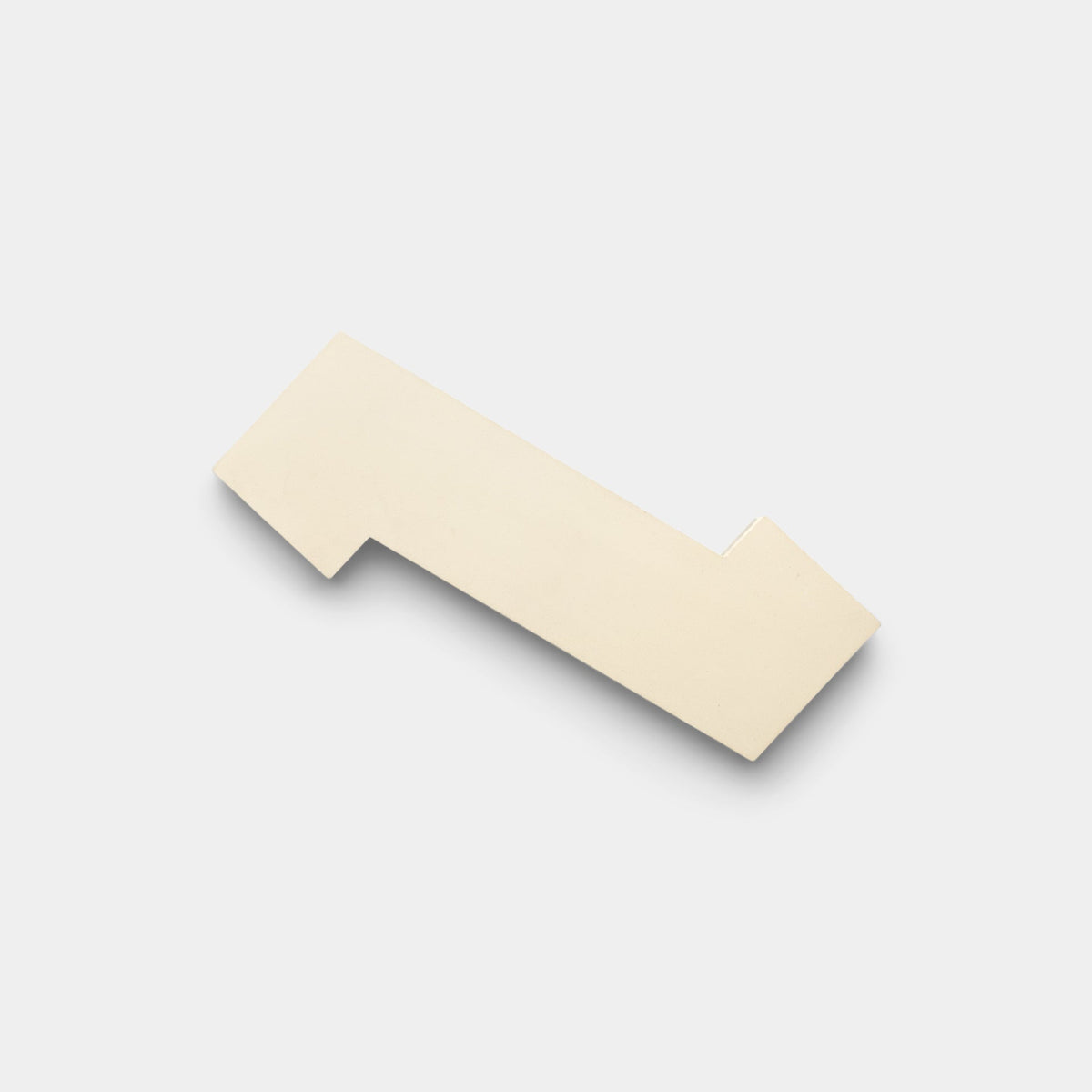 The Zig Zag Bone + Saddle sample by Zia Tile is a white, rectangular handmade tile featuring a shadow.