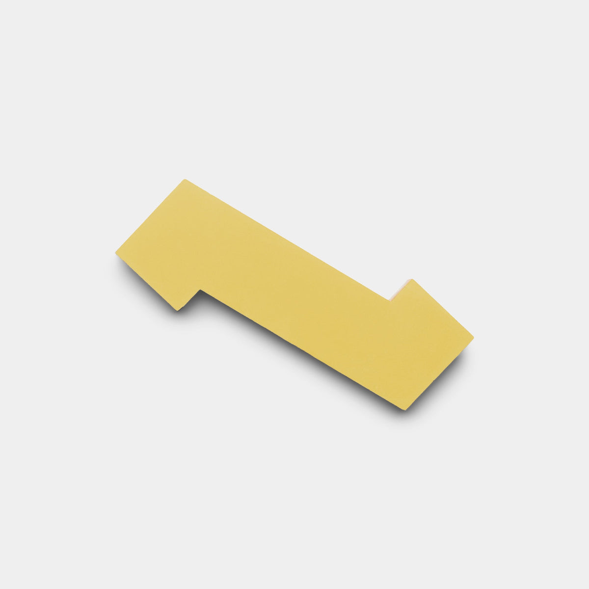 The Zig Zag Lemongrass + Mustard sample by Zia Tile is a handmade, flat yellow tile with irregular, angular edges, displayed against a plain white background.