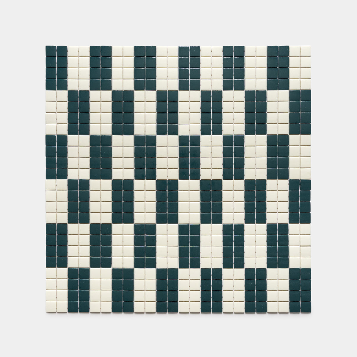 The d'Orsay Vespertine + Milk tile by Zia Tile features a square mosaic with vertical dark green rectangles on a white background, creating a geometric, checkerboard-like pattern.